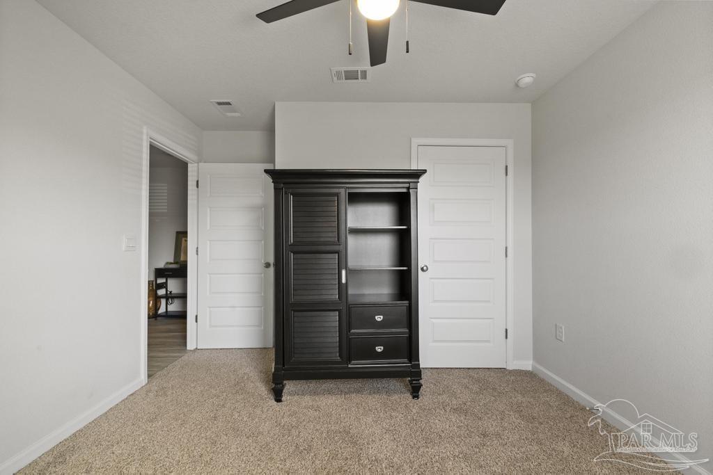 9336 Tara Circle Milton, FL 32583 - Photo 25 of 45 an empty room with closet