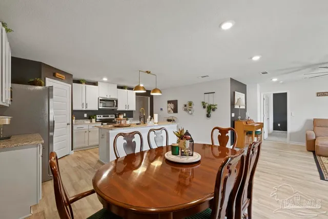 a view of a dining room with furniture