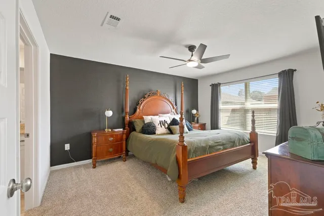 a bed room with a bed and a window