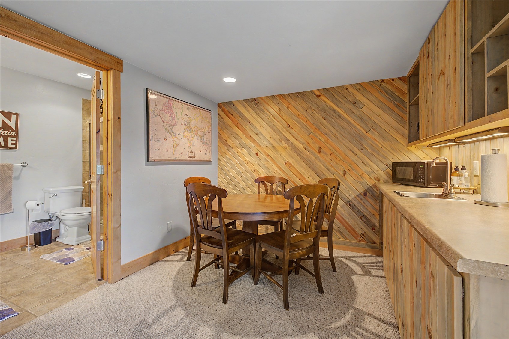 6726 Ryan Gulch Road, Unit 6726 Wildernest, CO 80498 - Photo 18 of 39 a view of a dining room with furniture and a kitchen