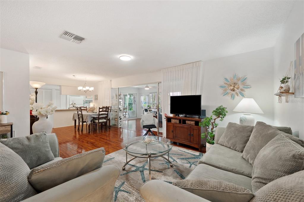 4659 Coachmen Road New Port Richey, FL 34655 - Photo 8 of 40 Living Room and Dining Room overlook the huge Florida Room