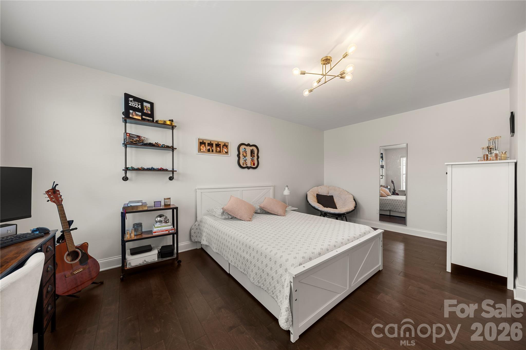 11266 Trailside Road Concord, NC 28027 - Photo 25 of 48 a bedroom with a bed and a chandelier