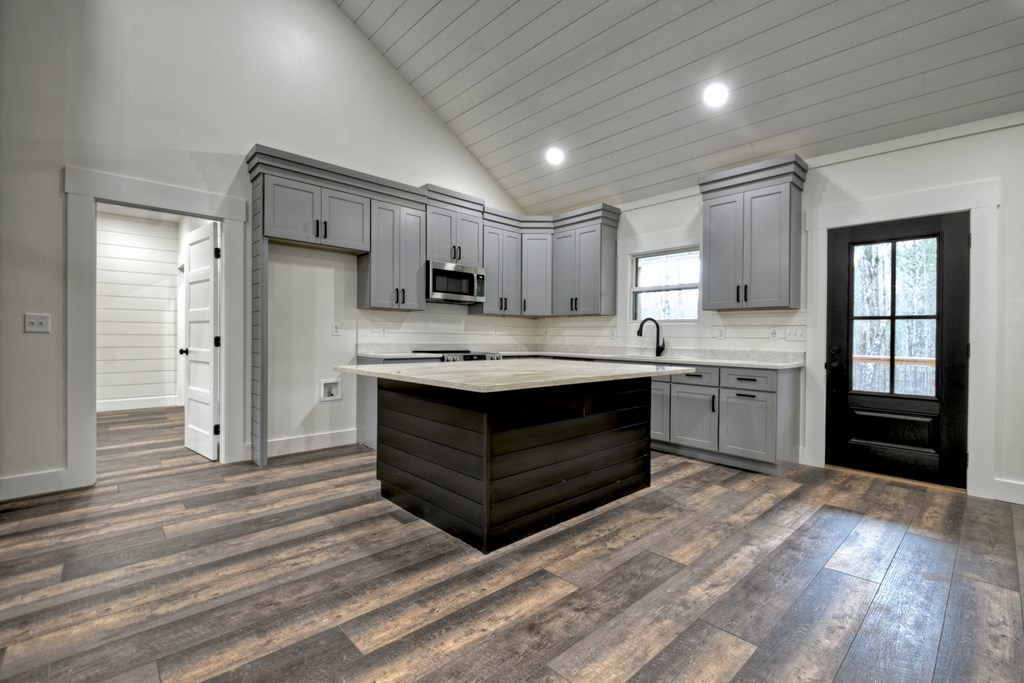 76 Cypress Circle Ellijay, GA 30540 - Photo 12 of 35 a kitchen with a stove sink and a refrigerator