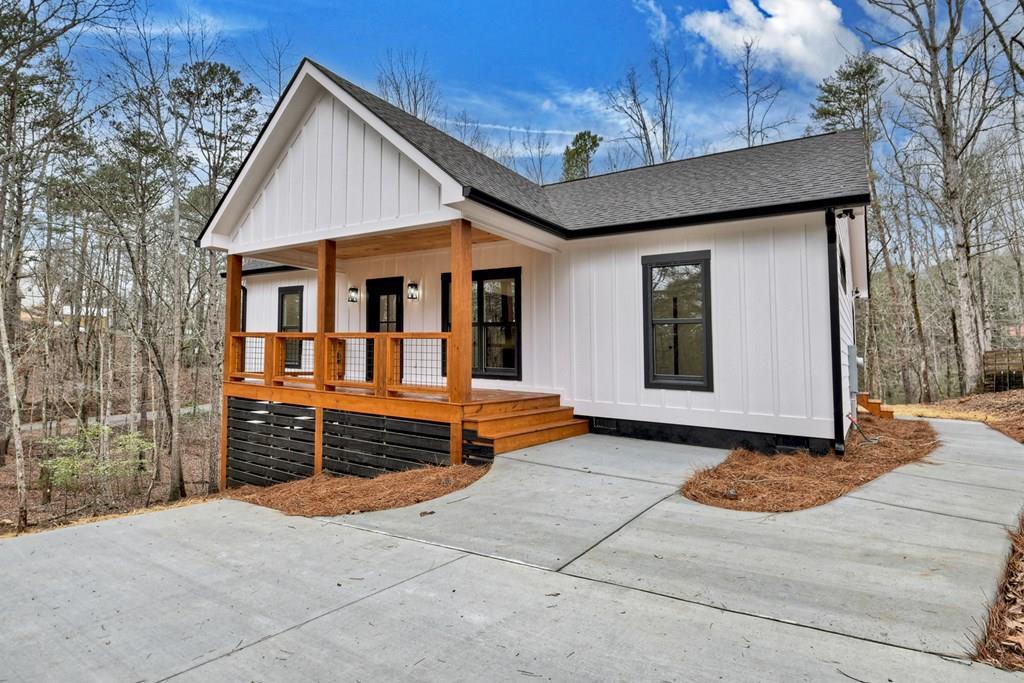 76 Cypress Circle Ellijay, GA 30540 - Photo 2 of 35 a front view of a house with parking space