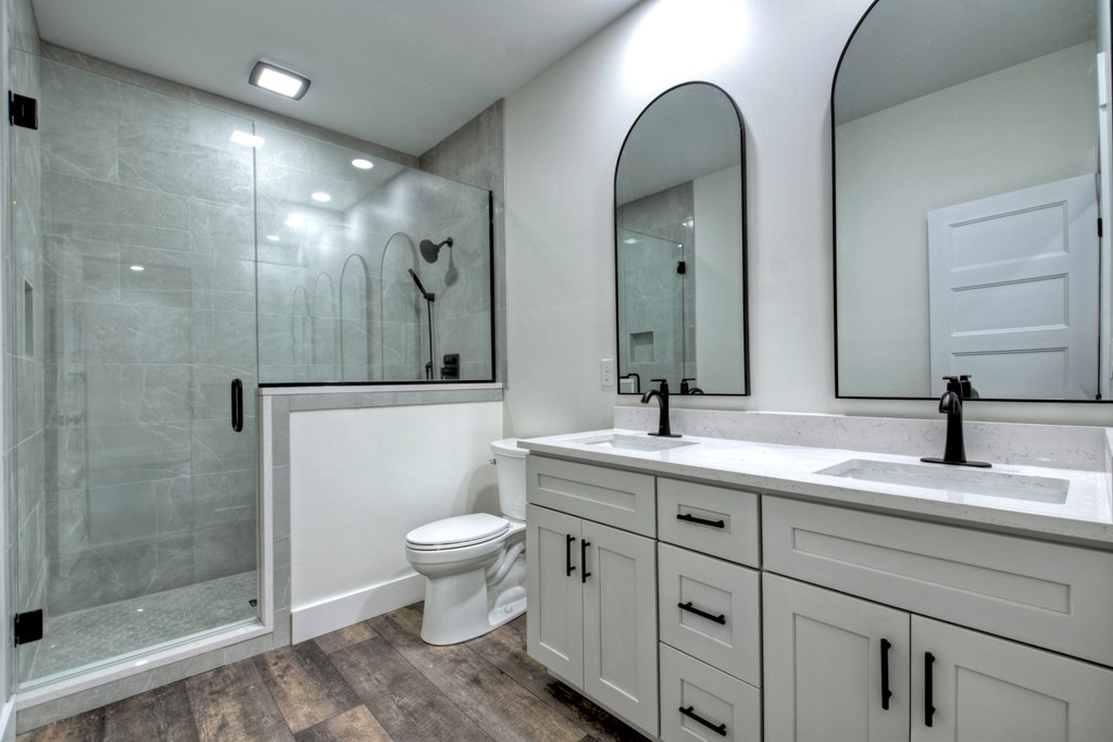 76 Cypress Circle Ellijay, GA 30540 - Photo 27 of 35 a bathroom with a double vanity sink mirror and toilet