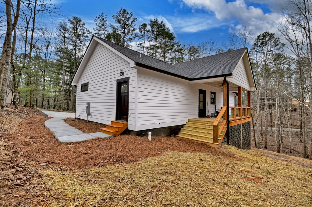 76 Cypress Circle Ellijay, GA 30540 - Photo 31 of 35 a view of a house with a yard and wooden fence