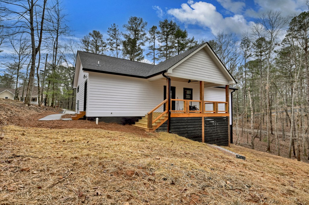 76 Cypress Circle Ellijay, GA 30540 - Photo 32 of 35 a front view of a house with a yard and garage