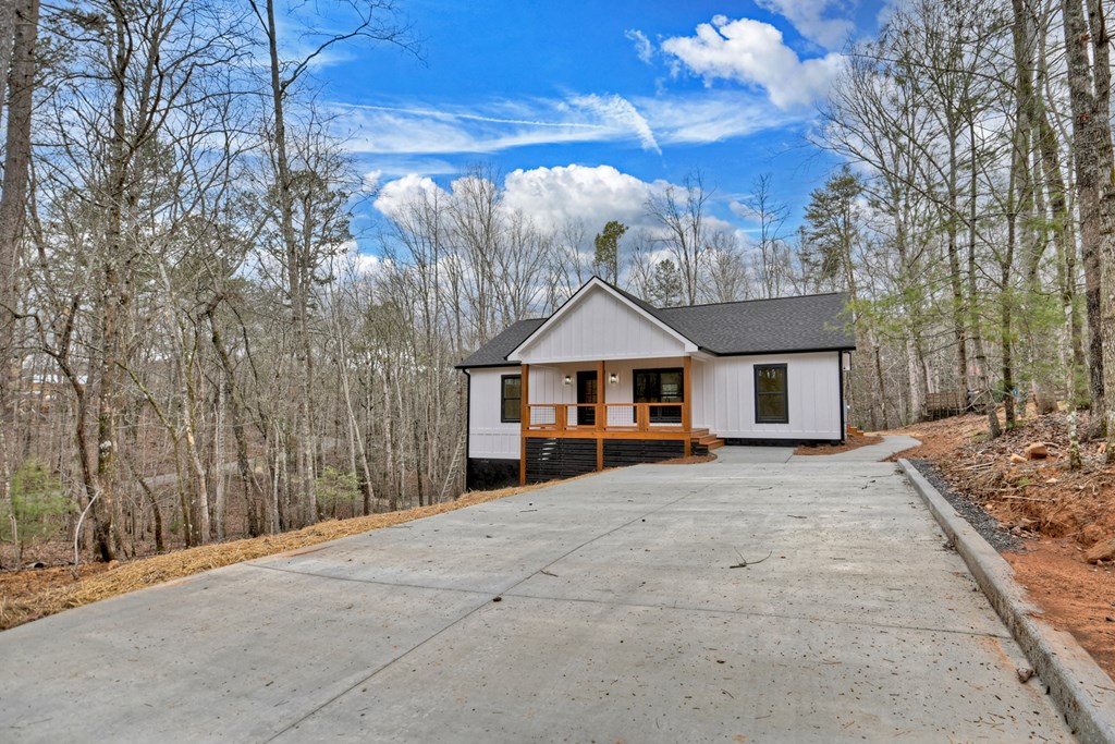 76 Cypress Circle Ellijay, GA 30540 - Photo 35 of 35 a front view of a house with a yard and garage
