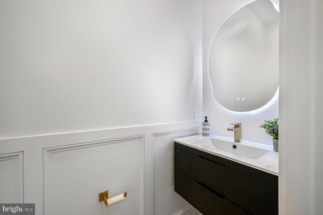 a view of a hallway with seating area