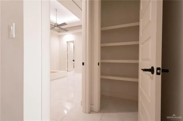 a view of an empty room with a window