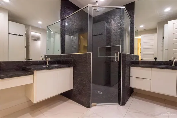 a view of a hallway with wooden floor and a window