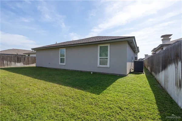a backyard of a house with lots of green space