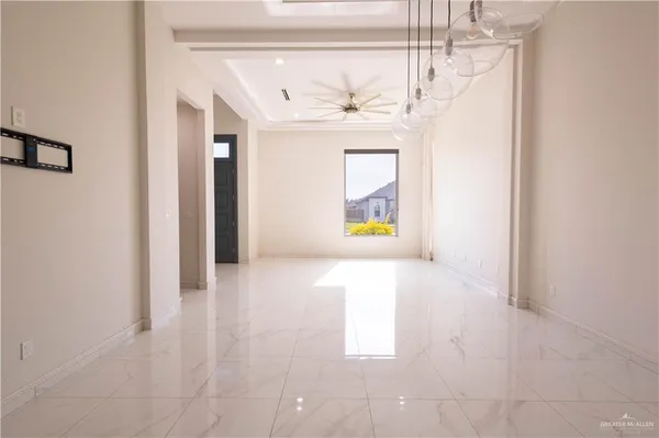 a view of a hallway with a chandelier