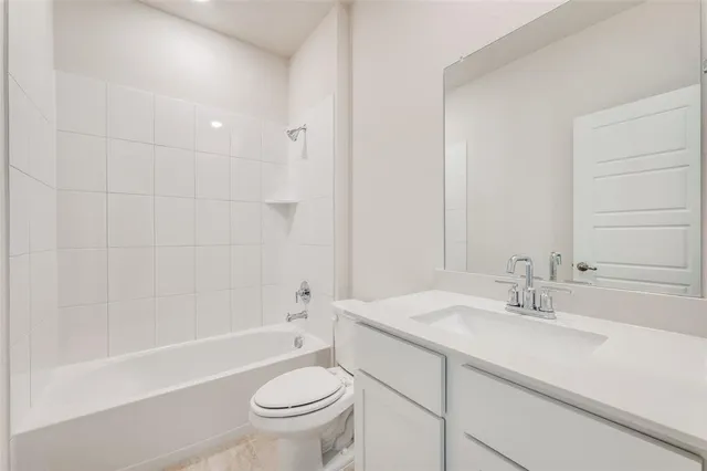 a bathroom with a sink a toilet and a bathtub