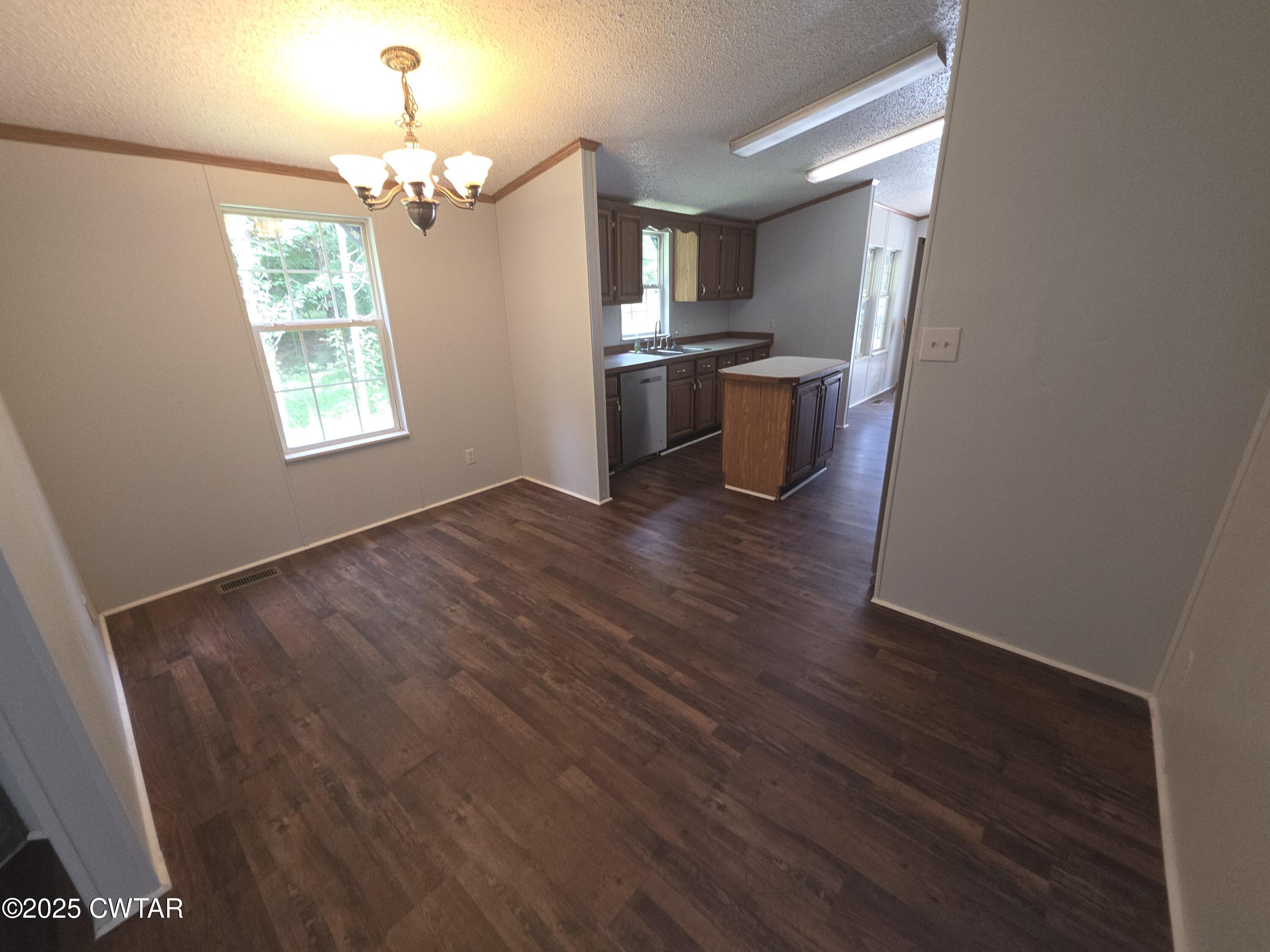 455 Liberty Road Beech Bluff, TN 38313 - Photo 15 of 63 wooden floor in an empty room with a window