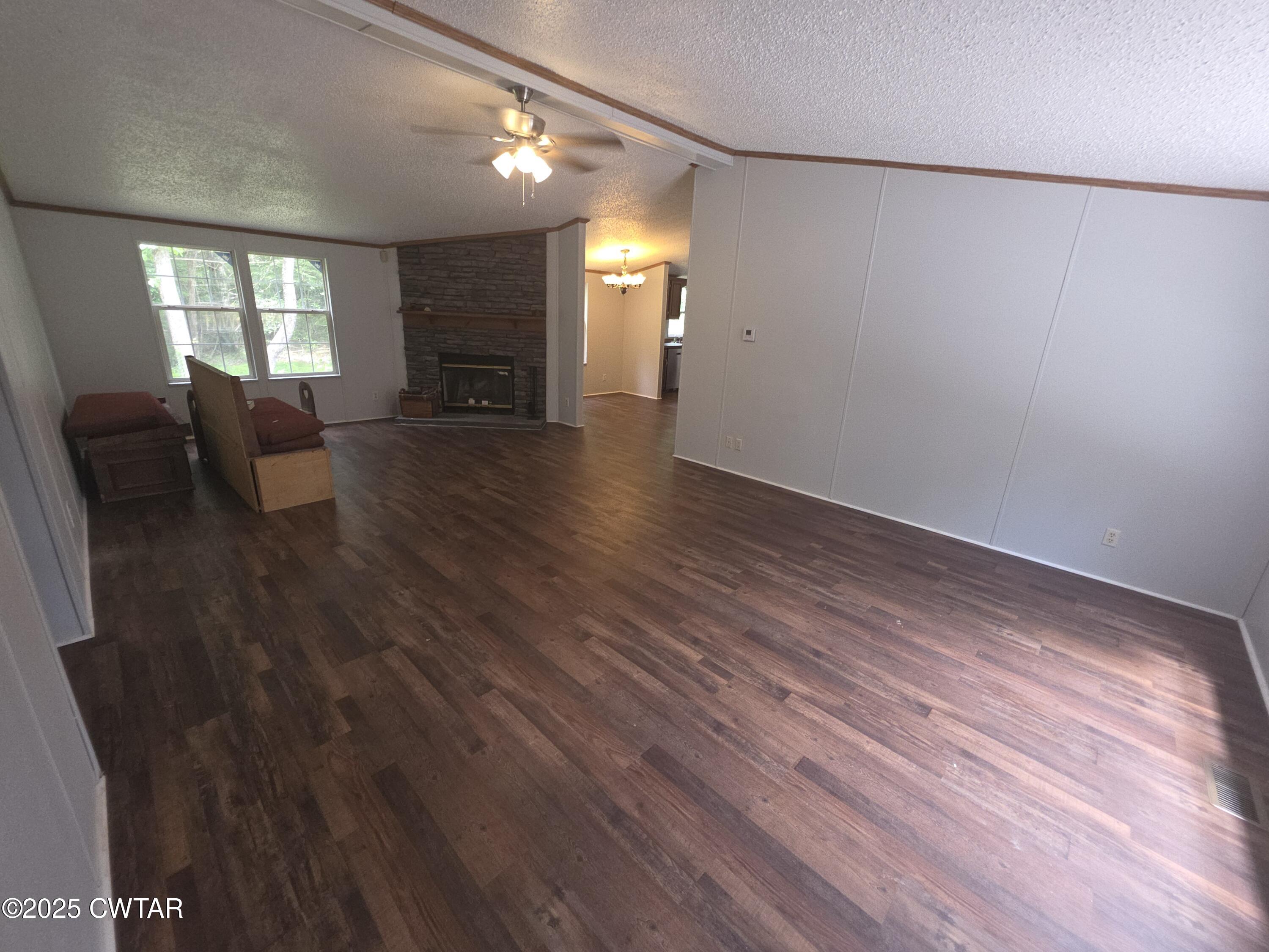 455 Liberty Road Beech Bluff, TN 38313 - Photo 17 of 63 a living room with couches and painted walls with wooden floor