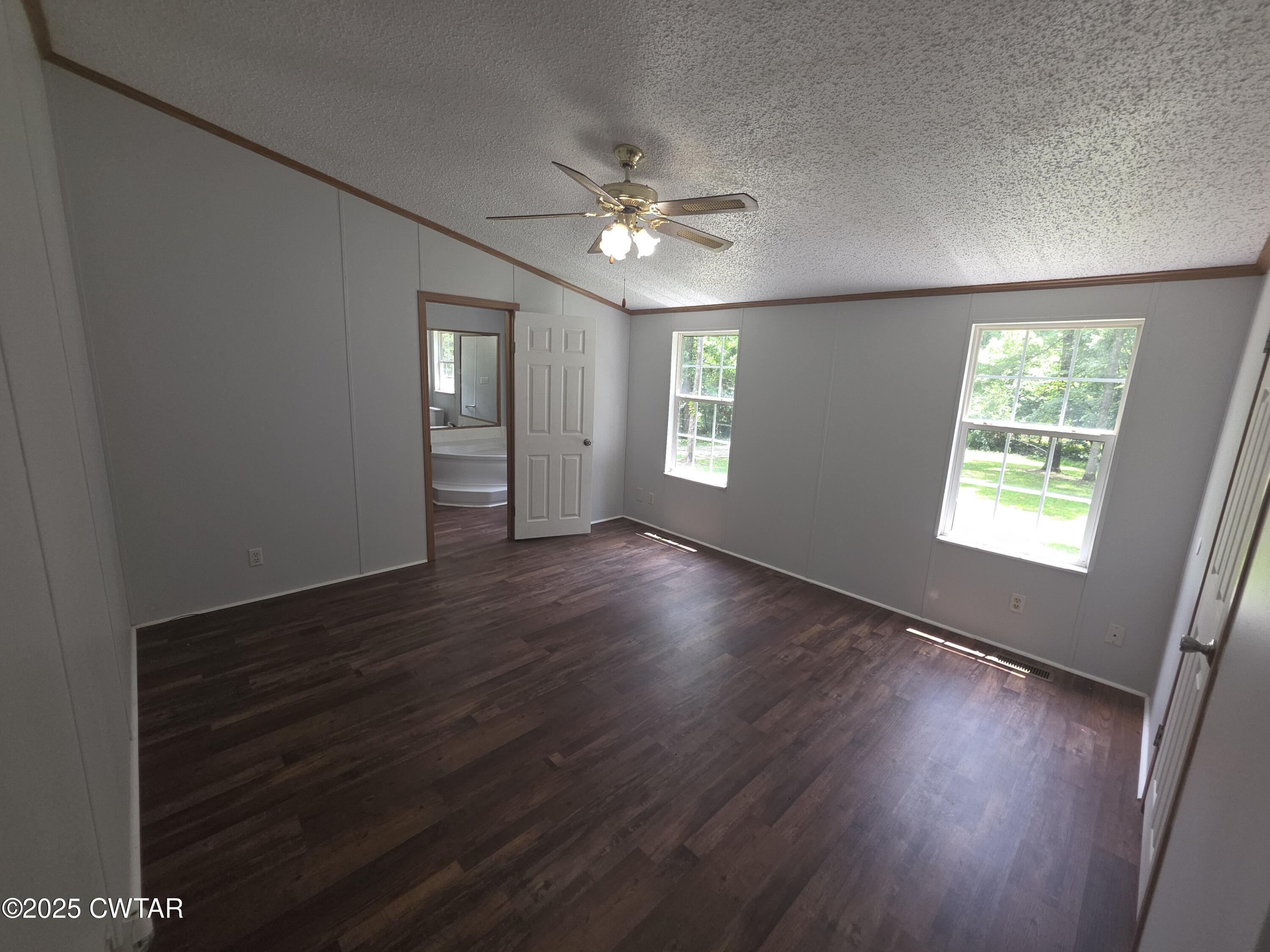 455 Liberty Road Beech Bluff, TN 38313 - Photo 21 of 63 a view of an empty room with wooden floor and a window