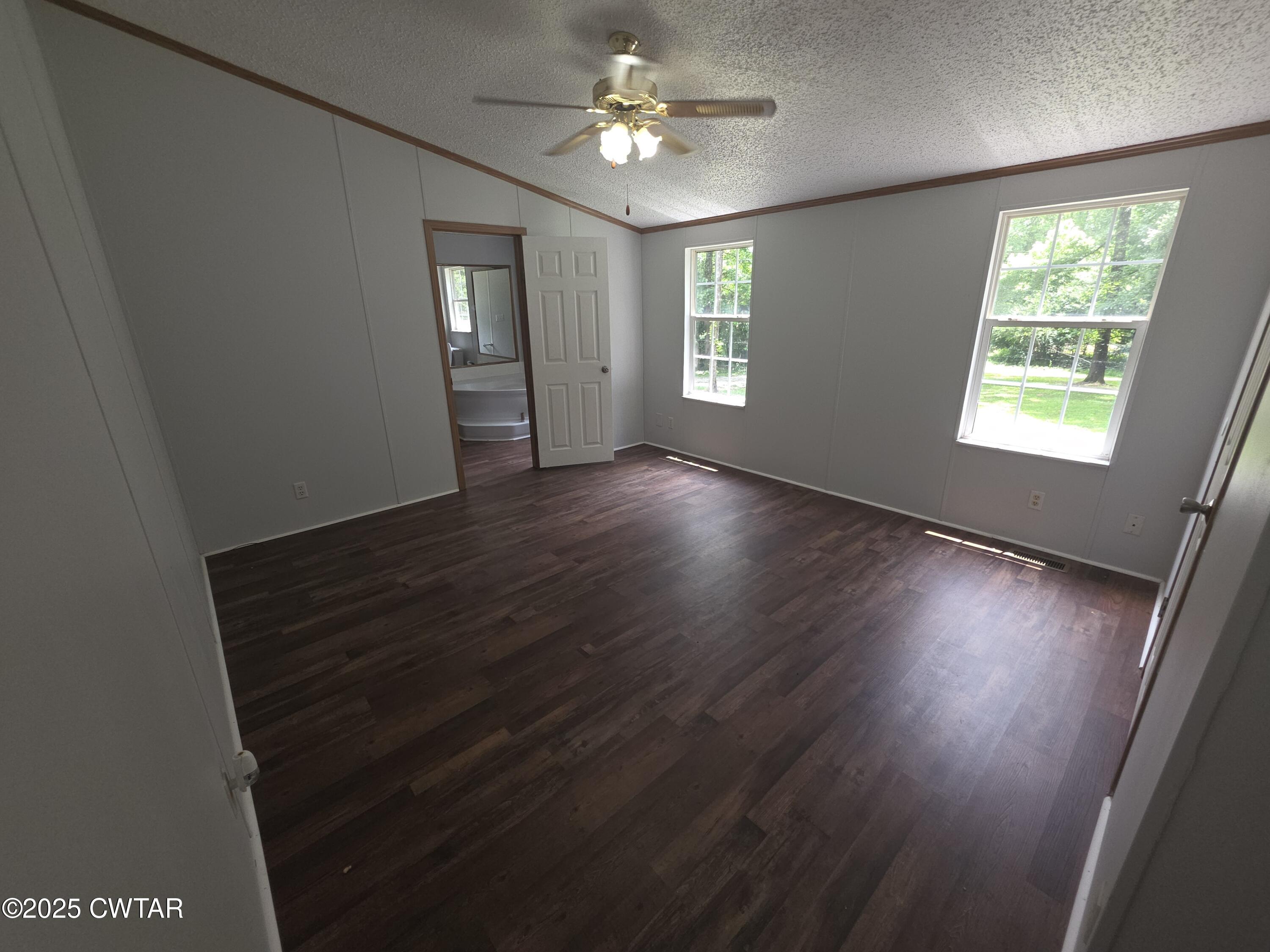 455 Liberty Road Beech Bluff, TN 38313 - Photo 24 of 63 wooden floor in an empty room with a window