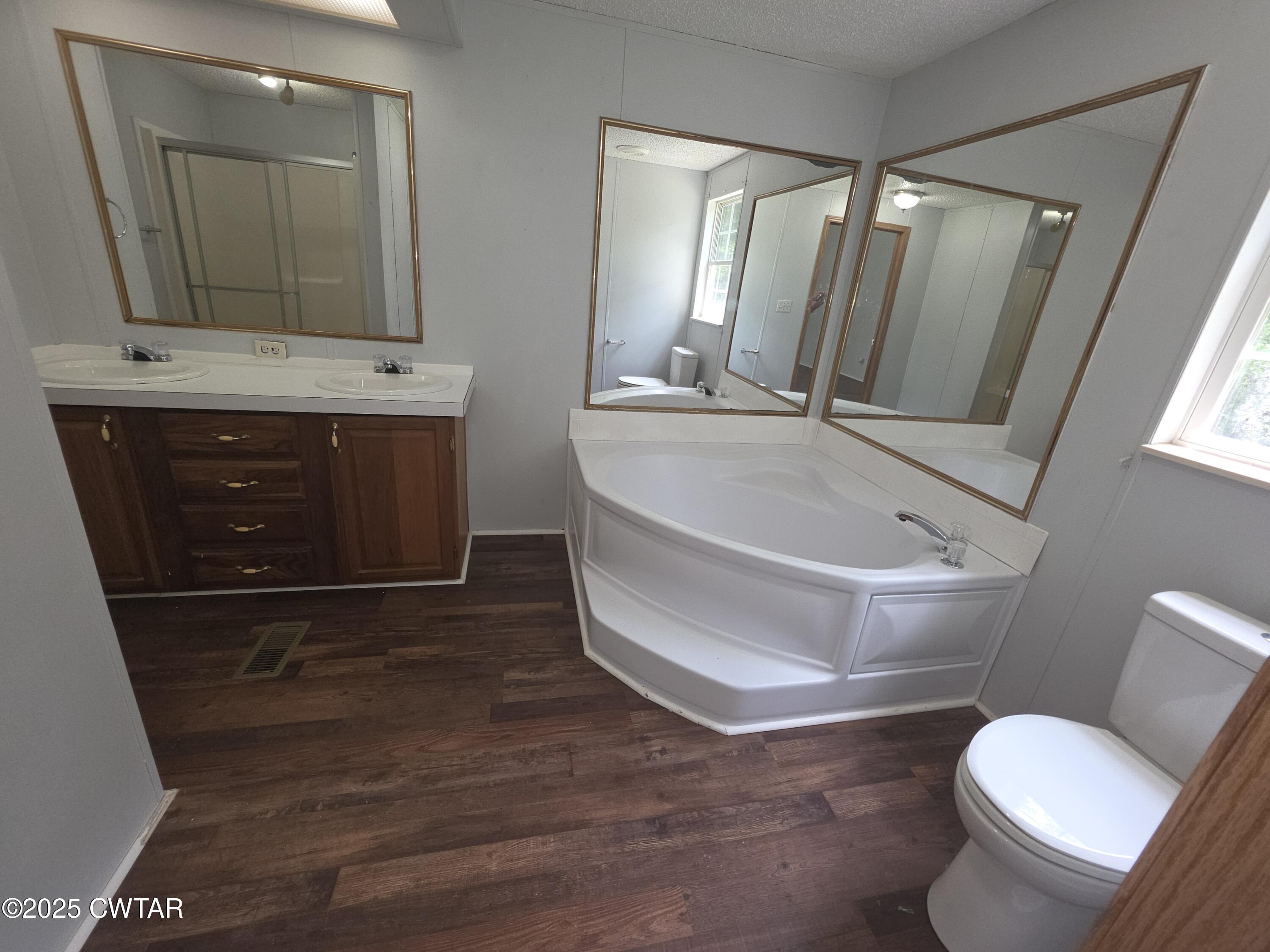 455 Liberty Road Beech Bluff, TN 38313 - Photo 25 of 63 a bathroom with a toilet a sink and mirror