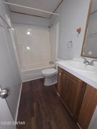 a view of a house with snow on the road