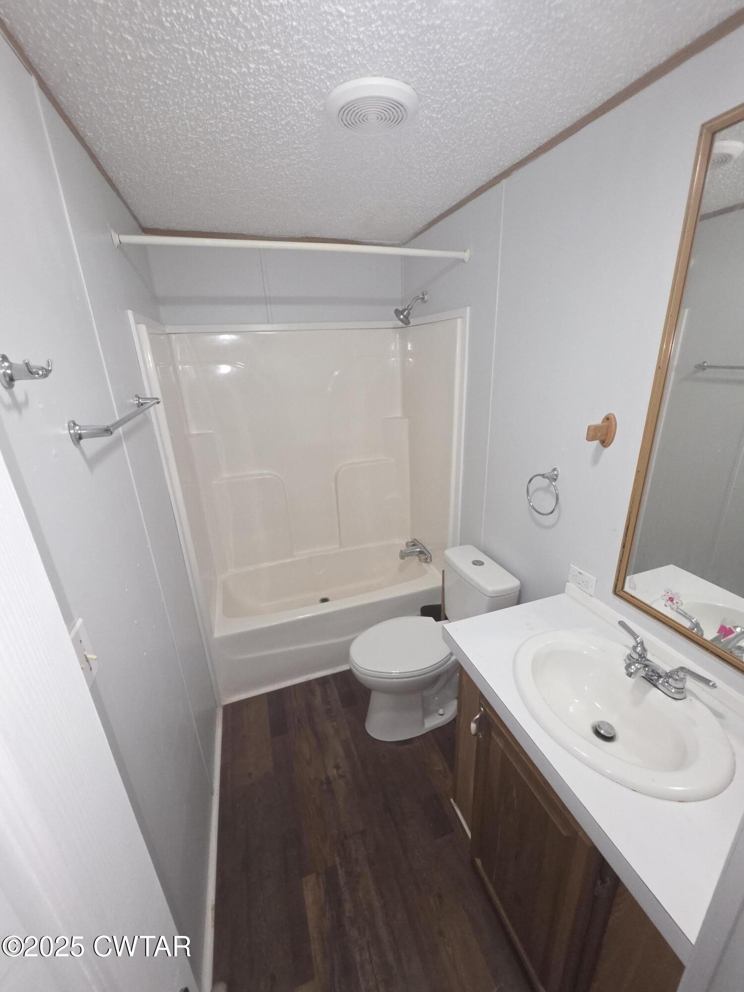 455 Liberty Road Beech Bluff, TN 38313 - Photo 34 of 63 a bathroom with a sink a toilet and shower