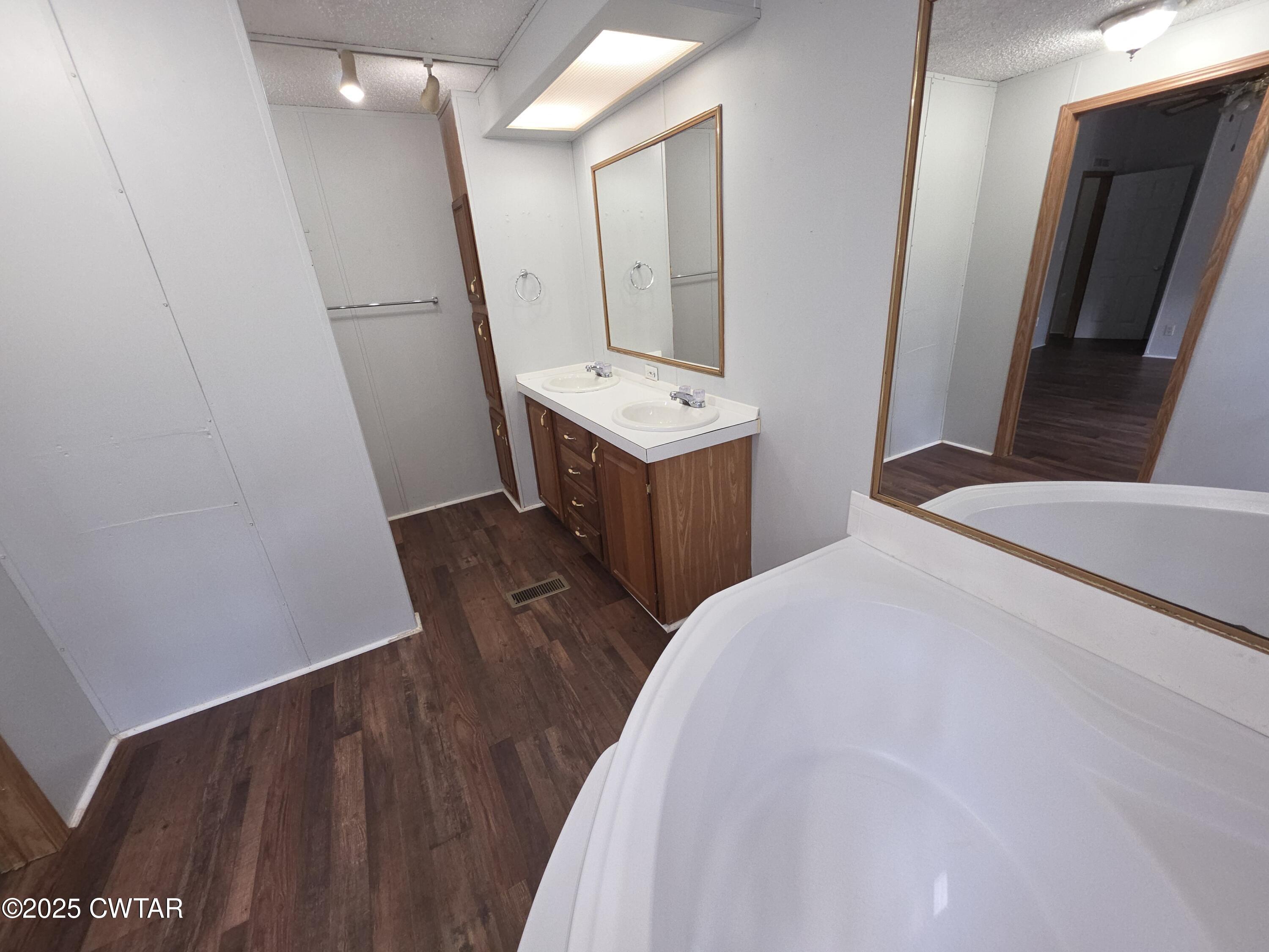 455 Liberty Road Beech Bluff, TN 38313 - Photo 46 of 63 a bedroom with a bed and a mirror