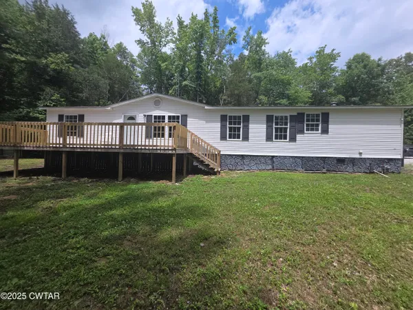 a view of outdoor space with wooden floor and window