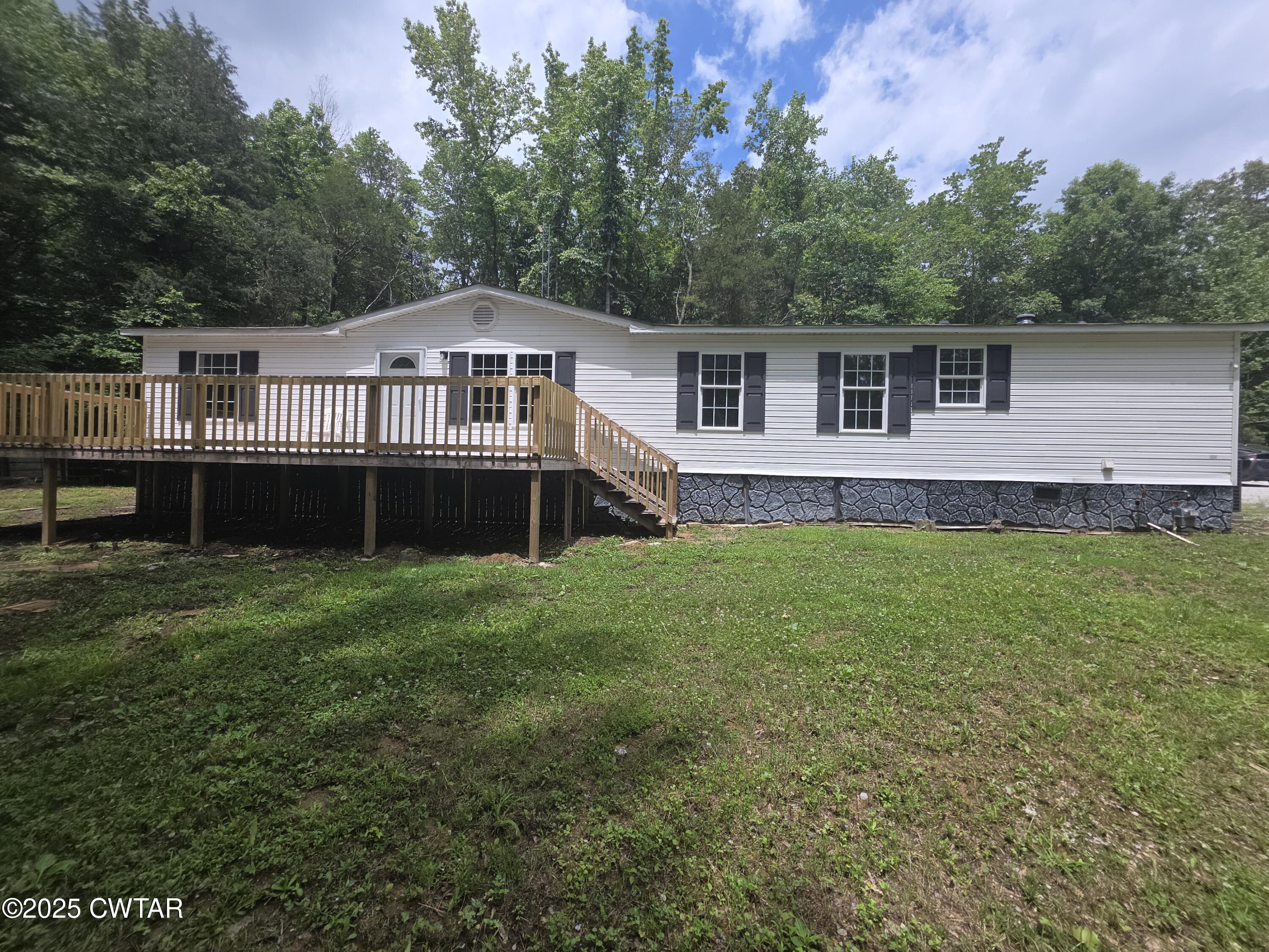 455 Liberty Road Beech Bluff, TN 38313 - Photo 5 of 63 a front view of a house with a garden