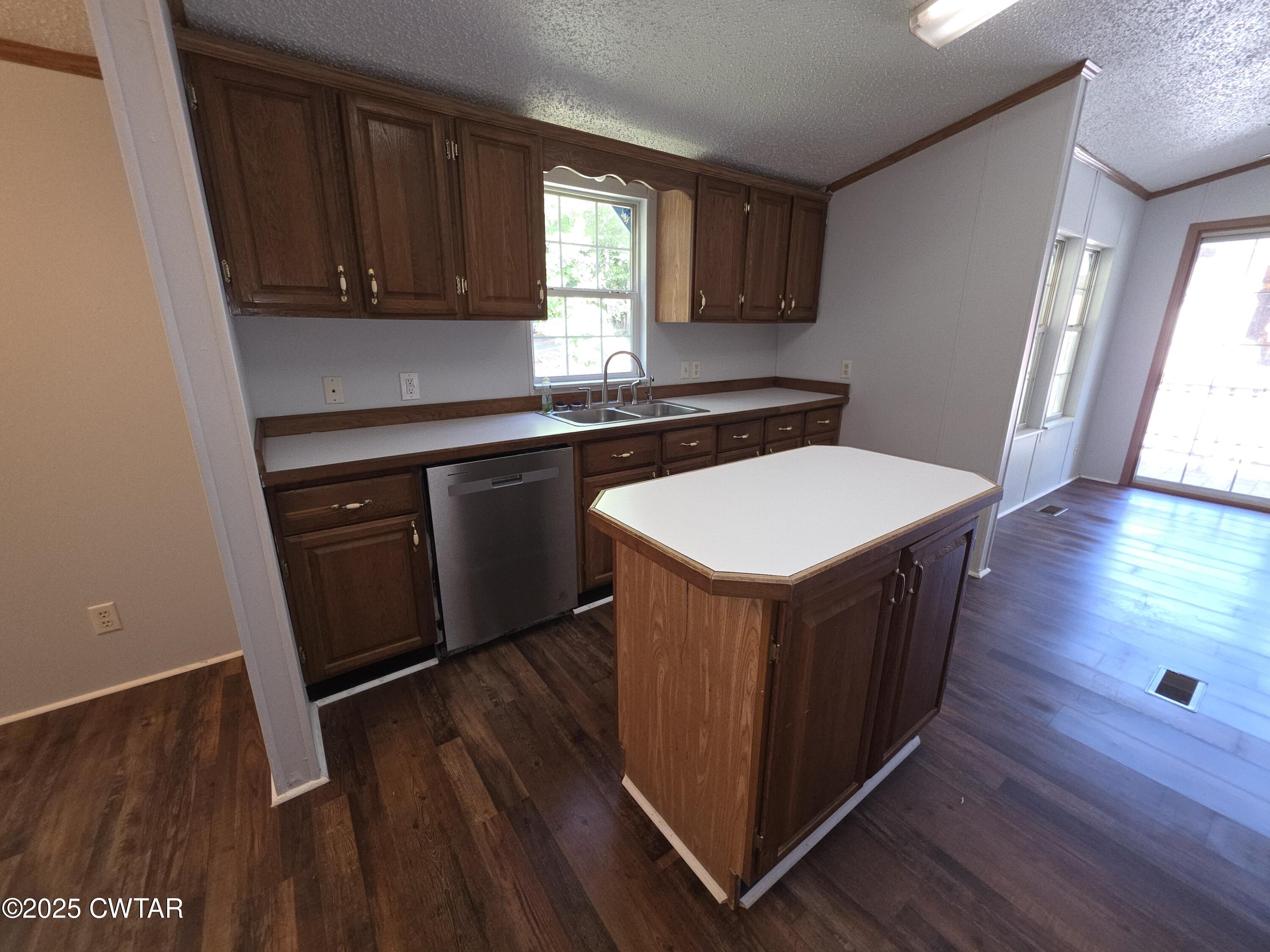 455 Liberty Road Beech Bluff, TN 38313 - Photo 53 of 63 a kitchen with kitchen island wooden floors appliances and cabinets