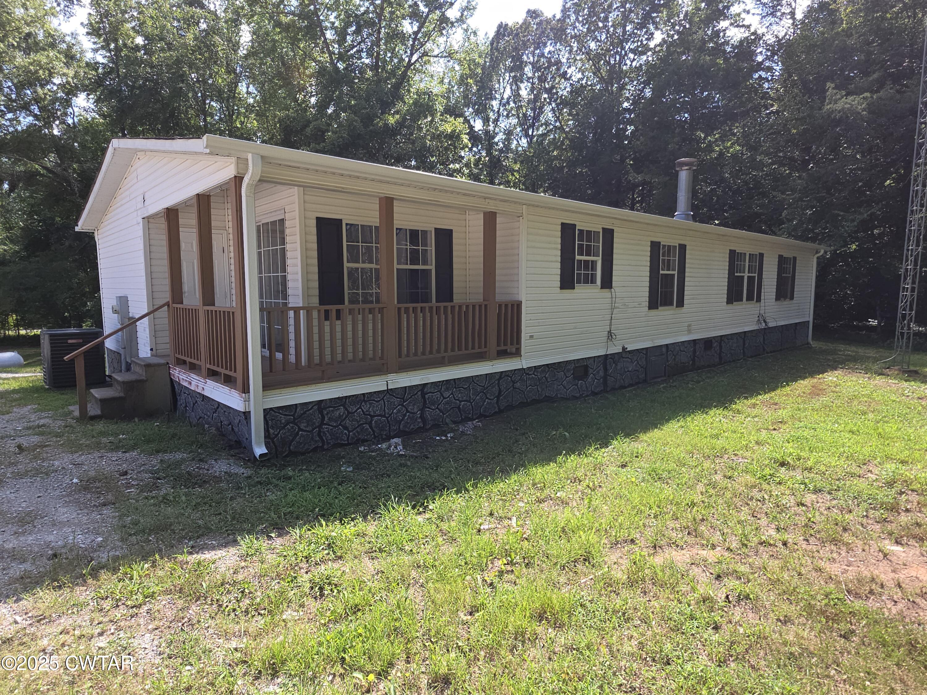 455 Liberty Road Beech Bluff, TN 38313 - Photo 57 of 63 a front view of a house with a yard