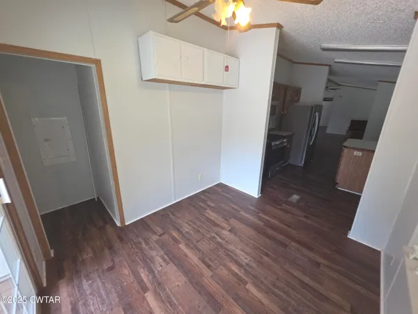 a kitchen with a sink stove and refrigerator