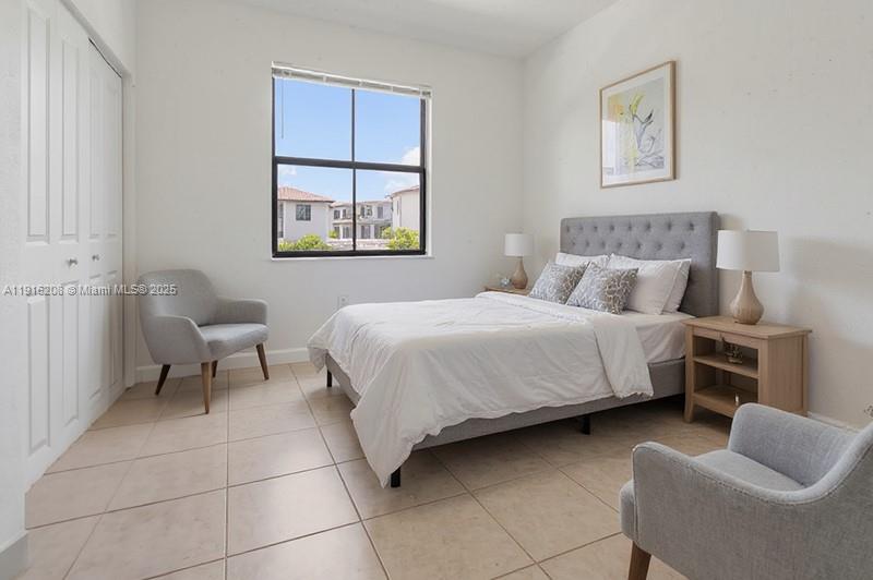 28637 Southwest 132nd Court Homestead, FL 33033 - Photo 23 of 45 a bedroom with a bed and couch