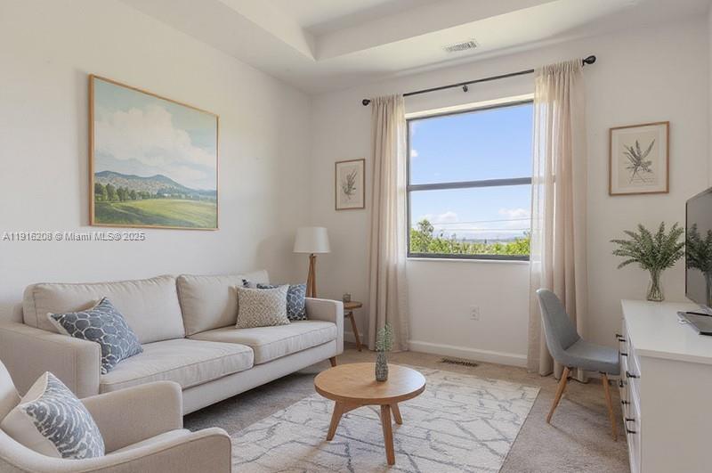 28637 Southwest 132nd Court Homestead, FL 33033 - Photo 28 of 45 a living room with furniture and a window