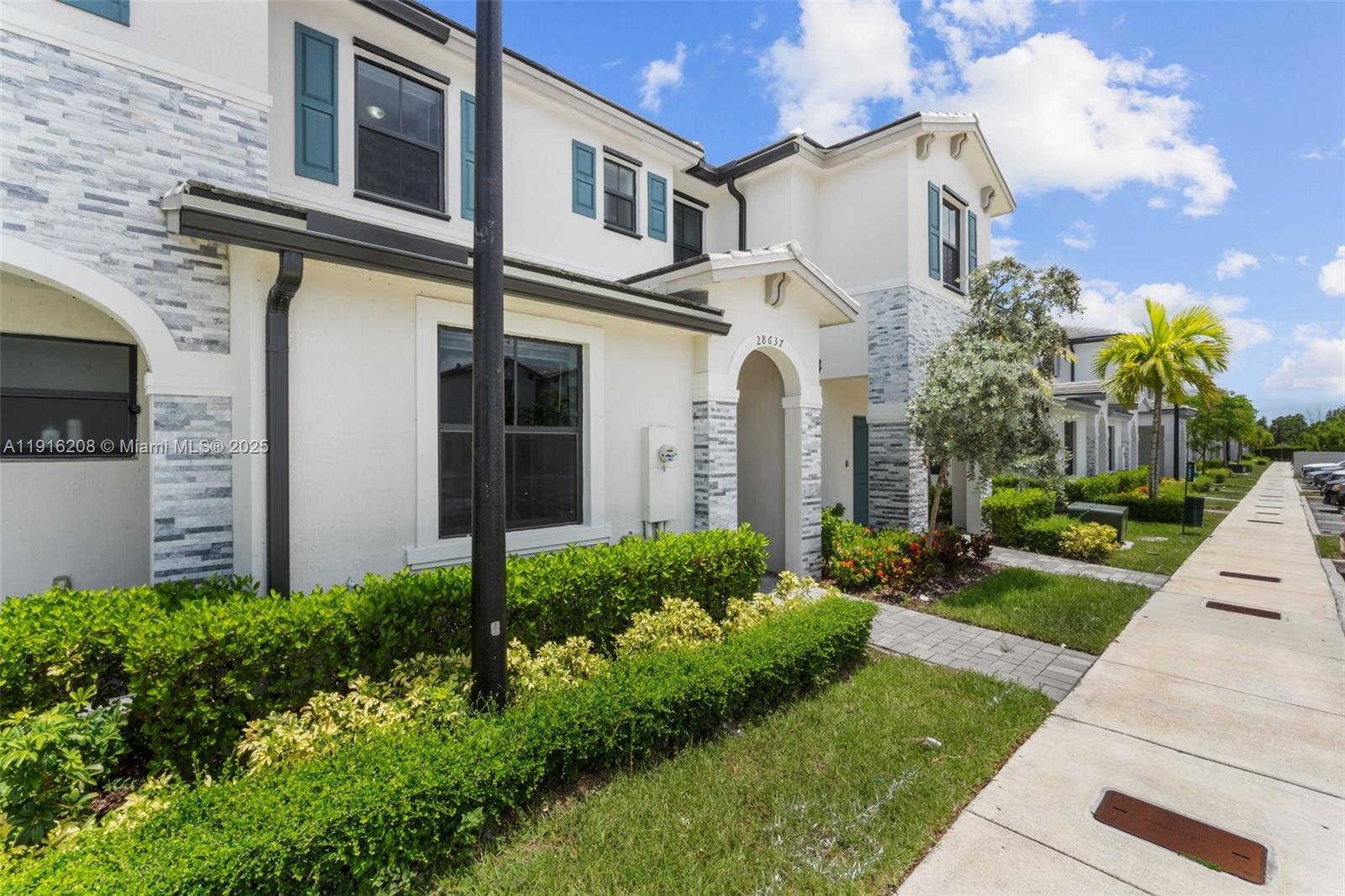 28637 Southwest 132nd Court Homestead, FL 33033 - Photo 3 of 45 a front view of a house with garden