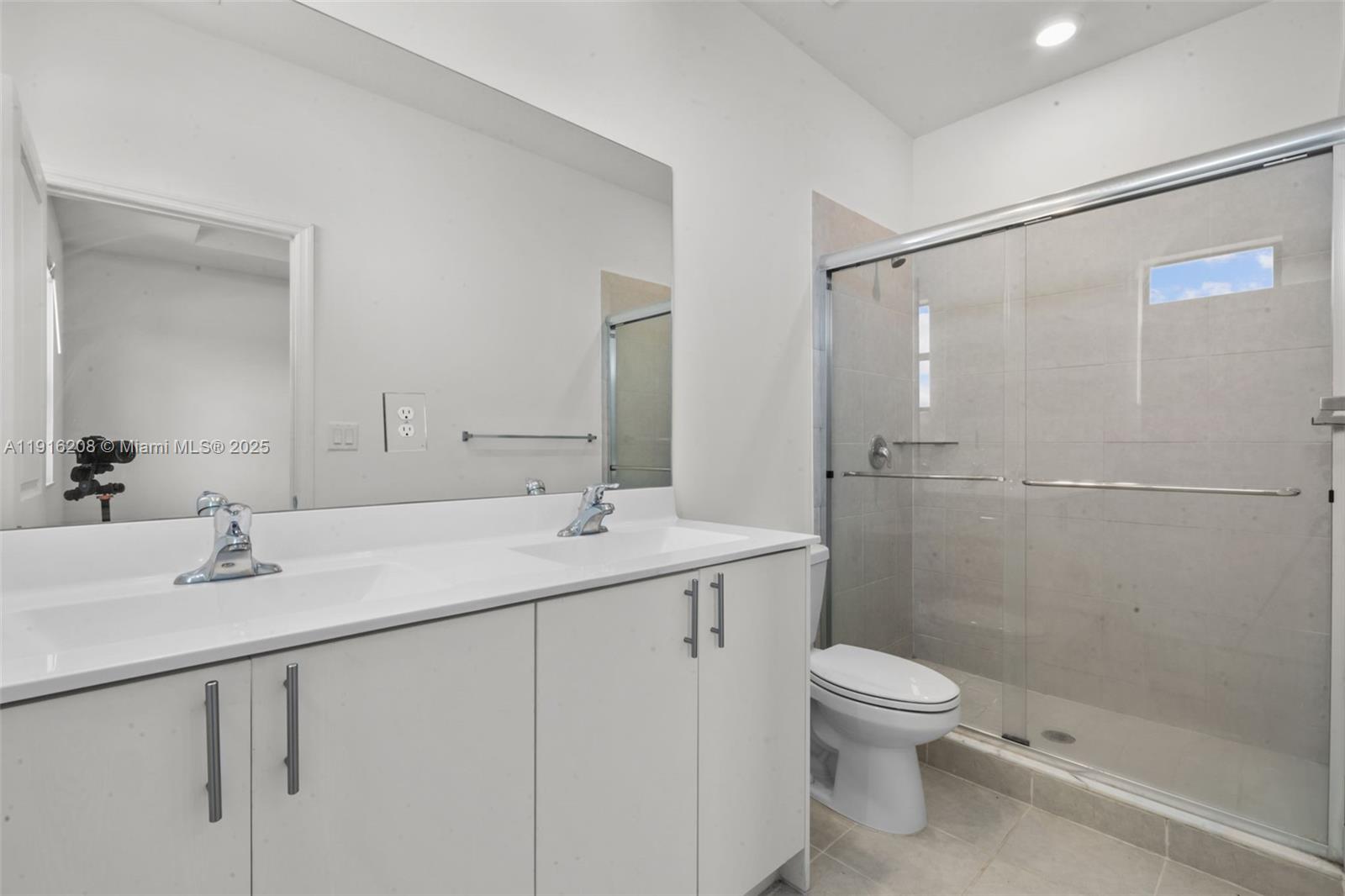 28637 Southwest 132nd Court Homestead, FL 33033 - Photo 32 of 45 a bathroom with a sink toilet and shower