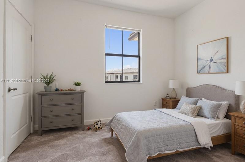 28637 Southwest 132nd Court Homestead, FL 33033 - Photo 33 of 45 a bedroom with a bed and a window