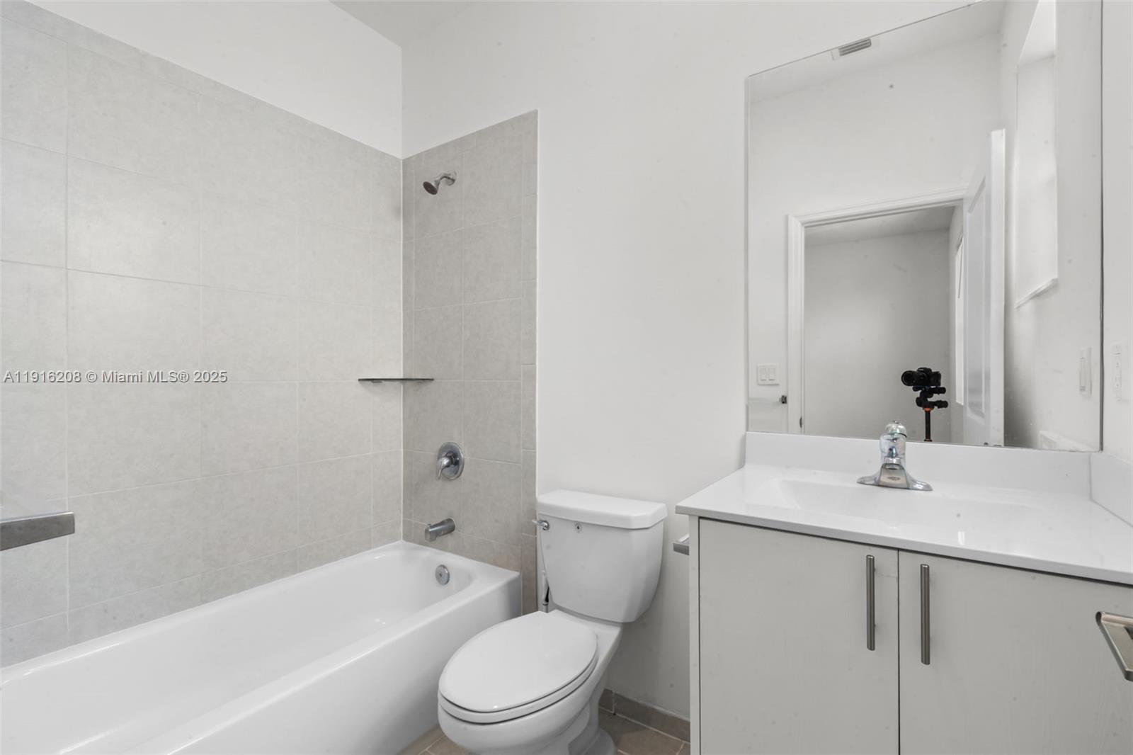 28637 Southwest 132nd Court Homestead, FL 33033 - Photo 35 of 45 a bathroom with a sink toilet vanity and shower