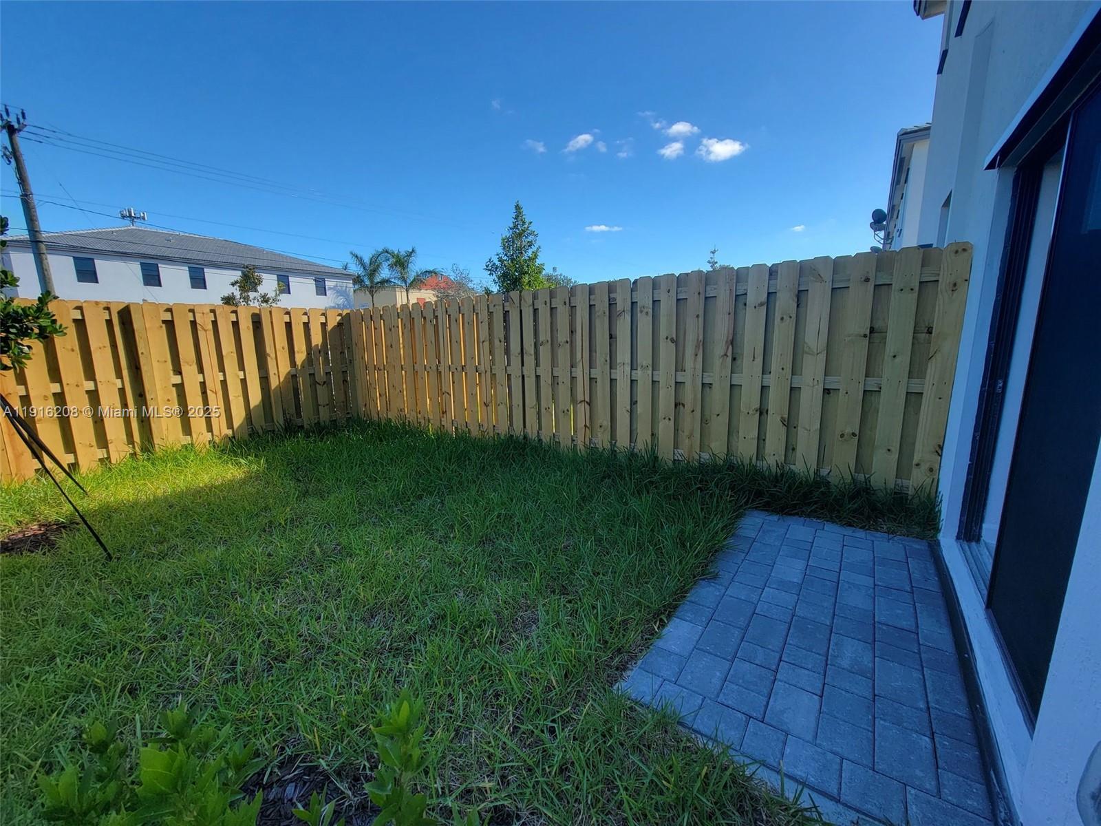 28637 Southwest 132nd Court Homestead, FL 33033 - Photo 38 of 45 a view of a backyard with wooden fence