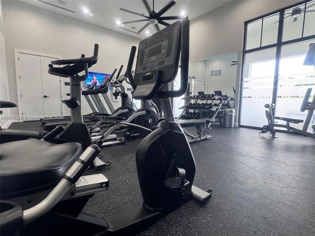 28637 Southwest 132nd Court Homestead, FL 33033 - Photo 42 of 45 a room with gym equipment and a large window