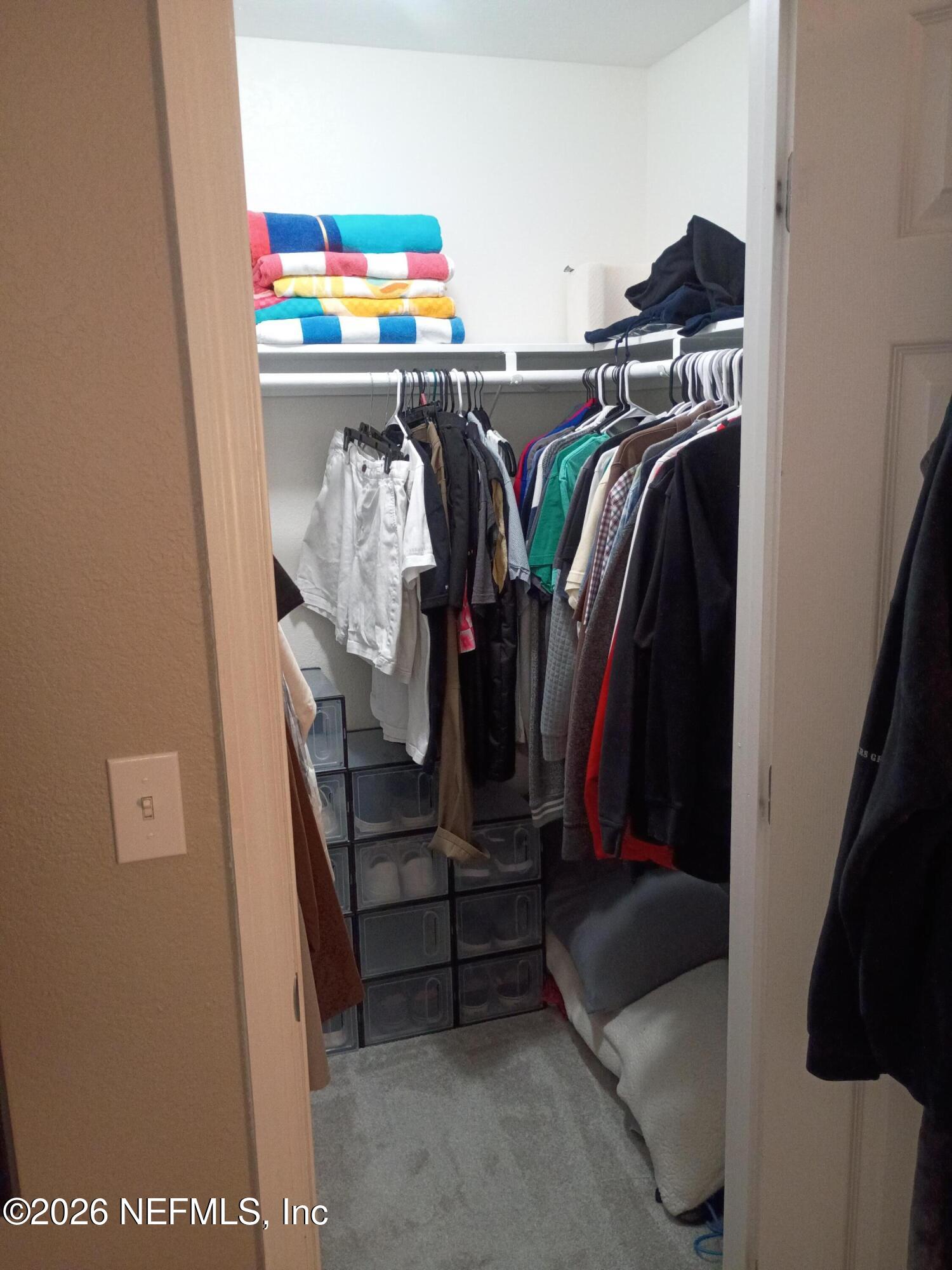 8880 Old Kings Road South, Unit 71 Jacksonville, FL 32257 - Photo 5 of 10 a view of walk in closet with clothes and shoes