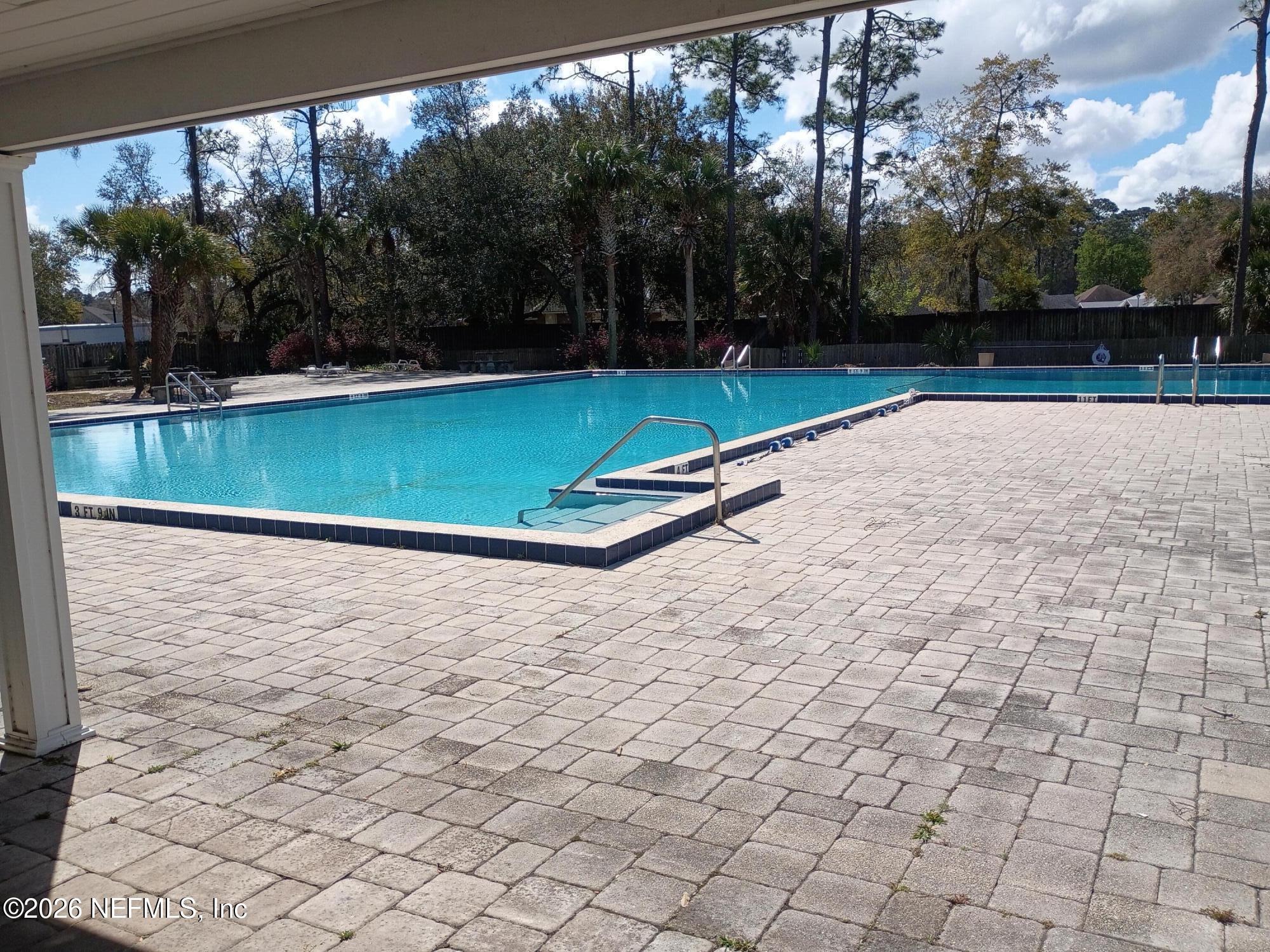 8880 Old Kings Road South, Unit 71 Jacksonville, FL 32257 - Photo 10 of 10 a view of a pool with a yard