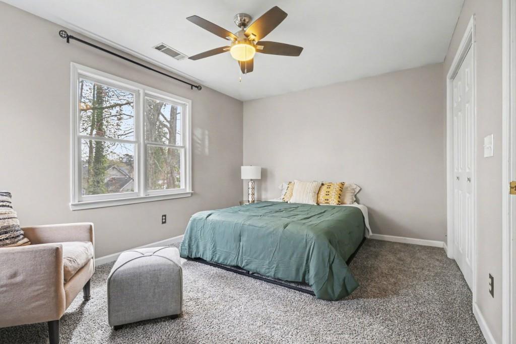 3793 Market Crescent Clarkston, GA 30021 - Photo 26 of 35 a bedroom with bed and a window