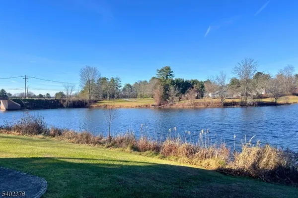 a view of a lake with a yard