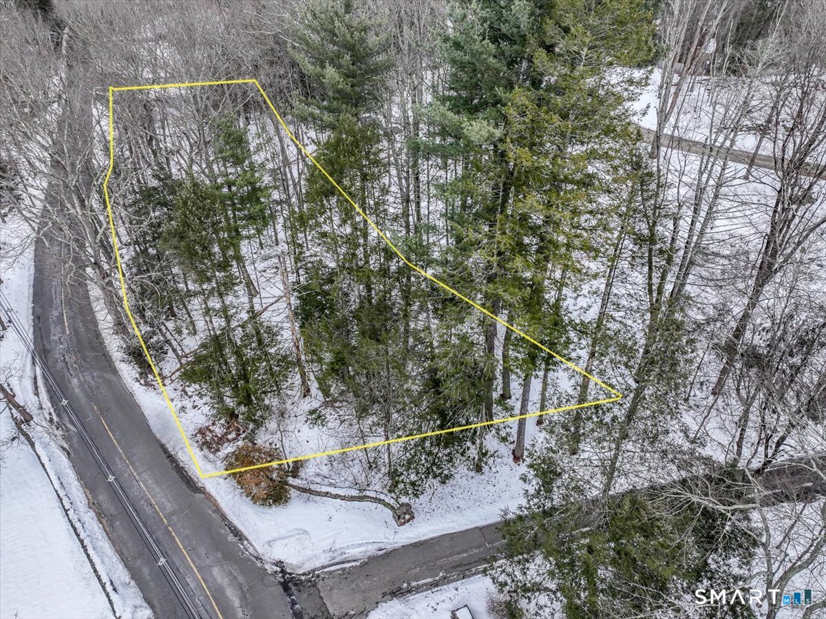 a view of balcony with wooden floor and fence