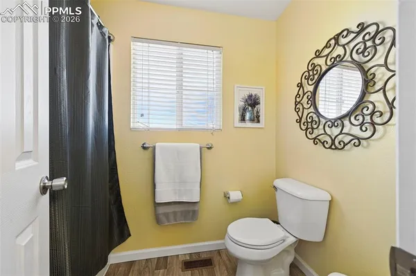 a bathroom with a toilet and a sink