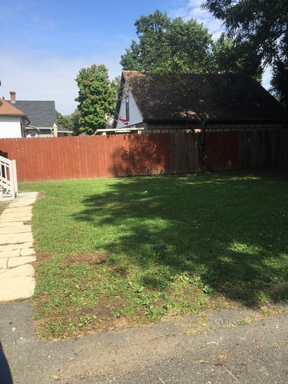 55 Rimmon Avenue Springfield, MA 01107 - Photo 16 of 17 a view of yard with swimming pool and trees in the background