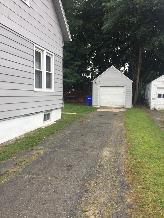 55 Rimmon Avenue Springfield, MA 01107 - Photo 17 of 17 a view of a house with a yard and garage