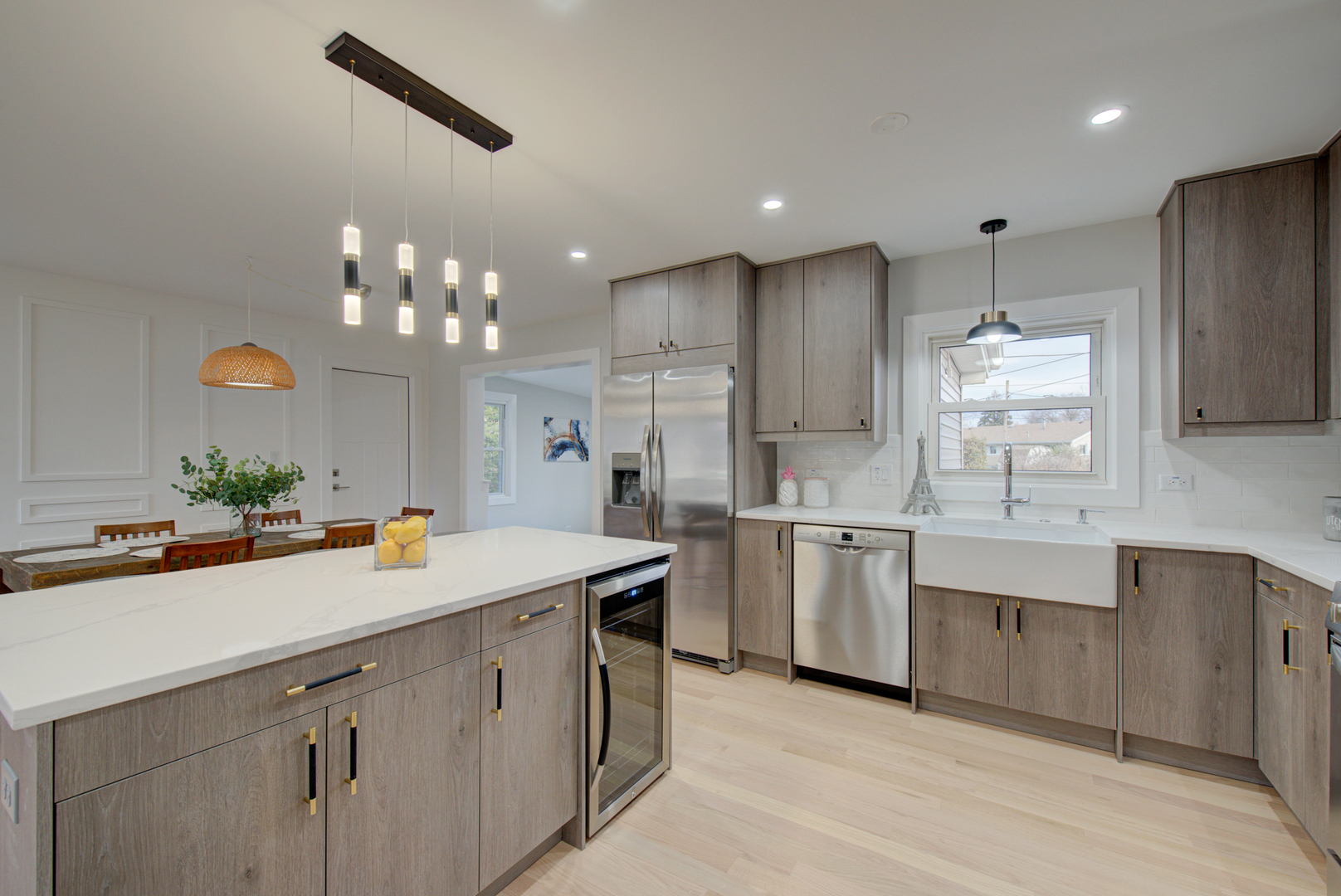 560 Lincoln Drive Hoffman Estates, IL 60169 - Photo 11 of 38 a kitchen with a sink chandelier and refrigerator