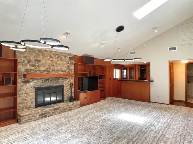 a view of an empty room with a fireplace