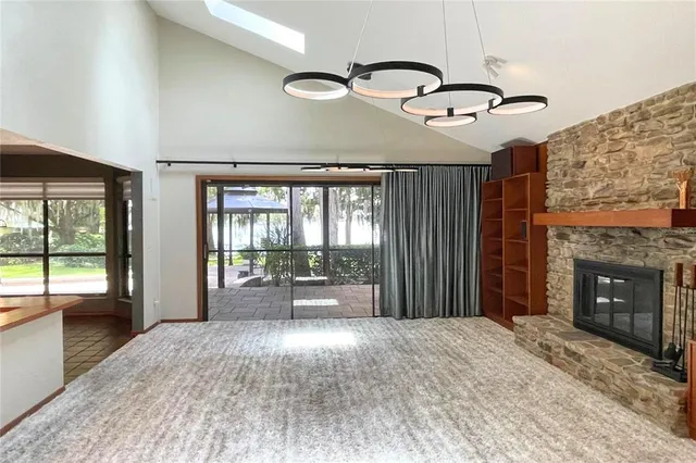 a bedroom with a large bed and a large window